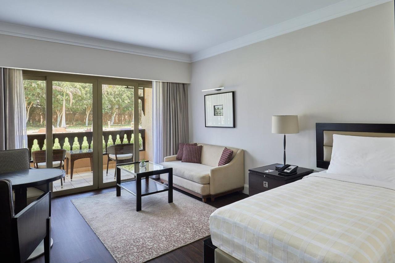Deluxe Garden View Room, Guest room, 1 King, Garden view, Balcony